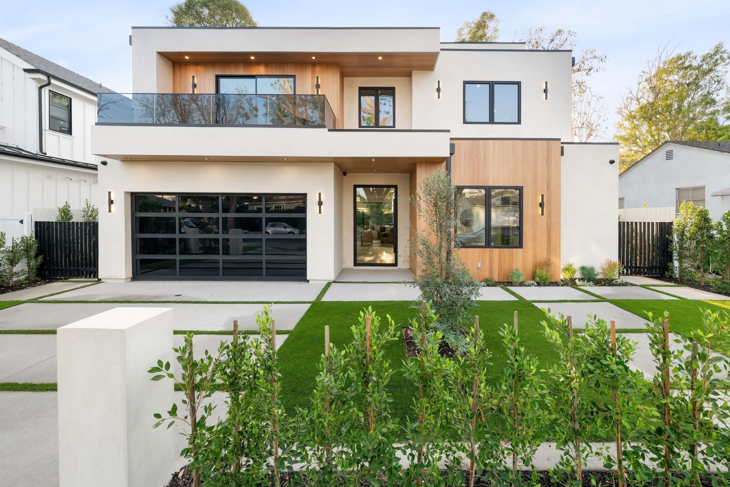 Modern,two Story,house,with,sleek,design,,large,windows,,and,landscaped